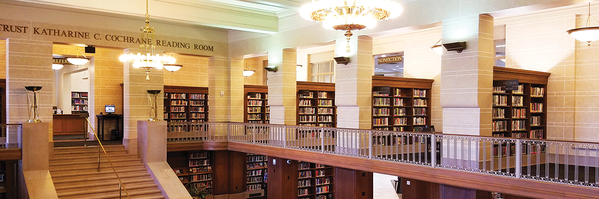 Friends of the library header showing a beautiful interior with rows of bookshelves, a staircase, and chandeliers