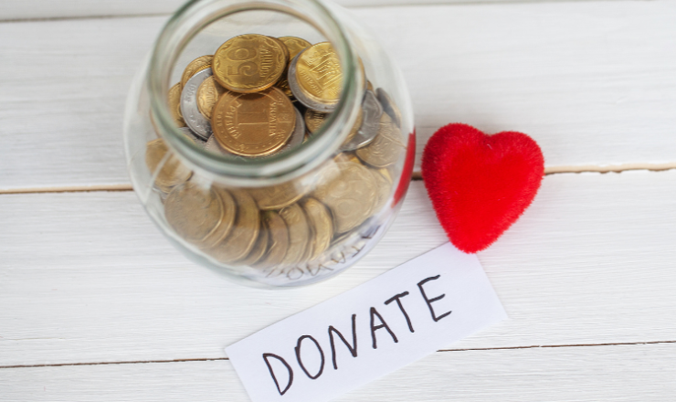 Donate linked image showing a change jar and red heart